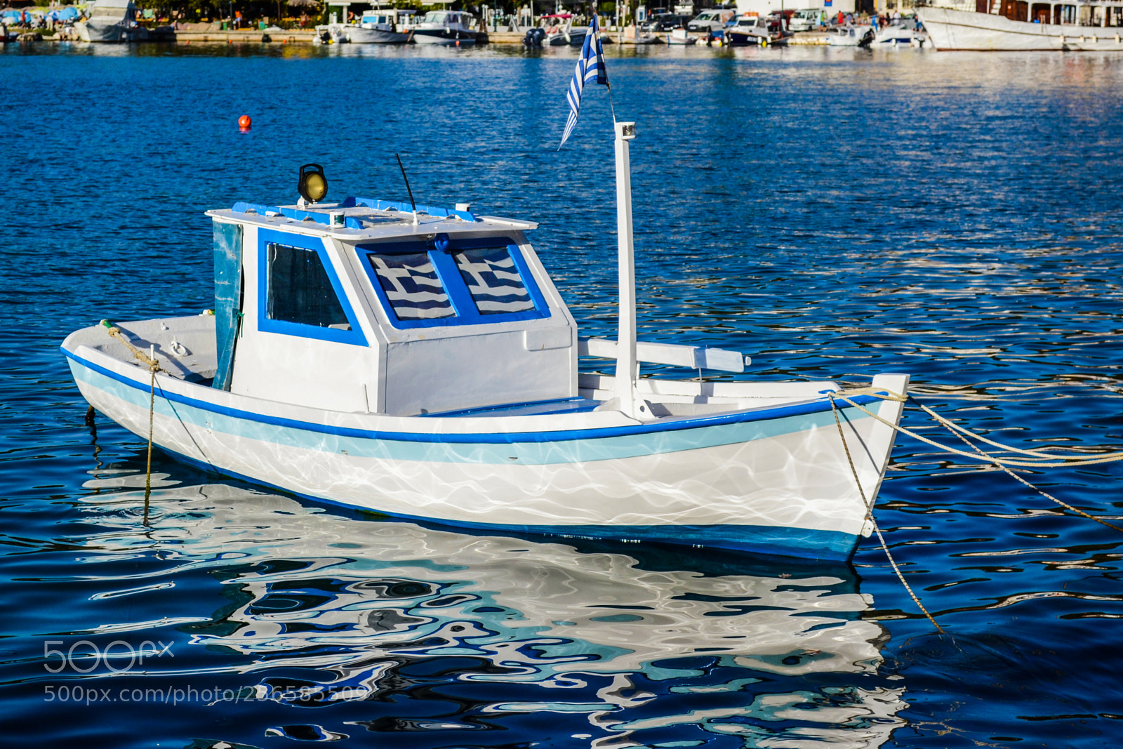 Nikon D3100 sample photo. Small boat in harbour photography