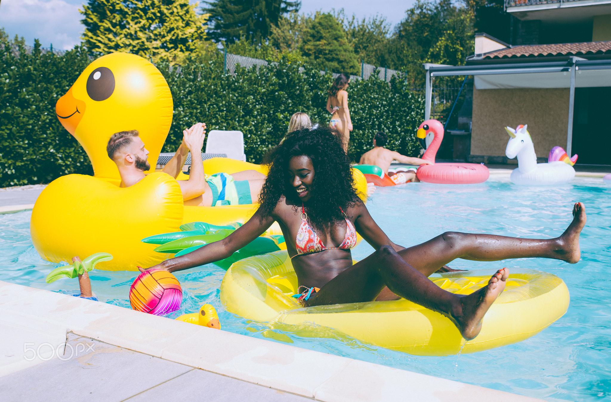 group of friends having fun in the swimming pool