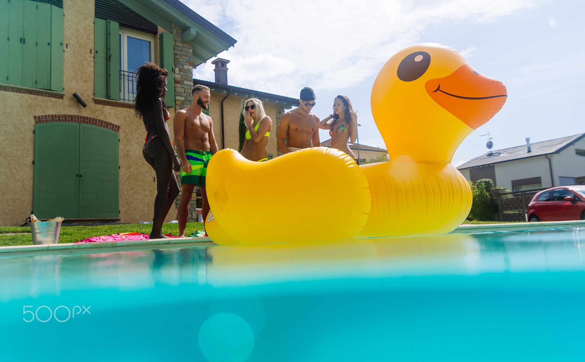 group of friends having fun in the swimming pool