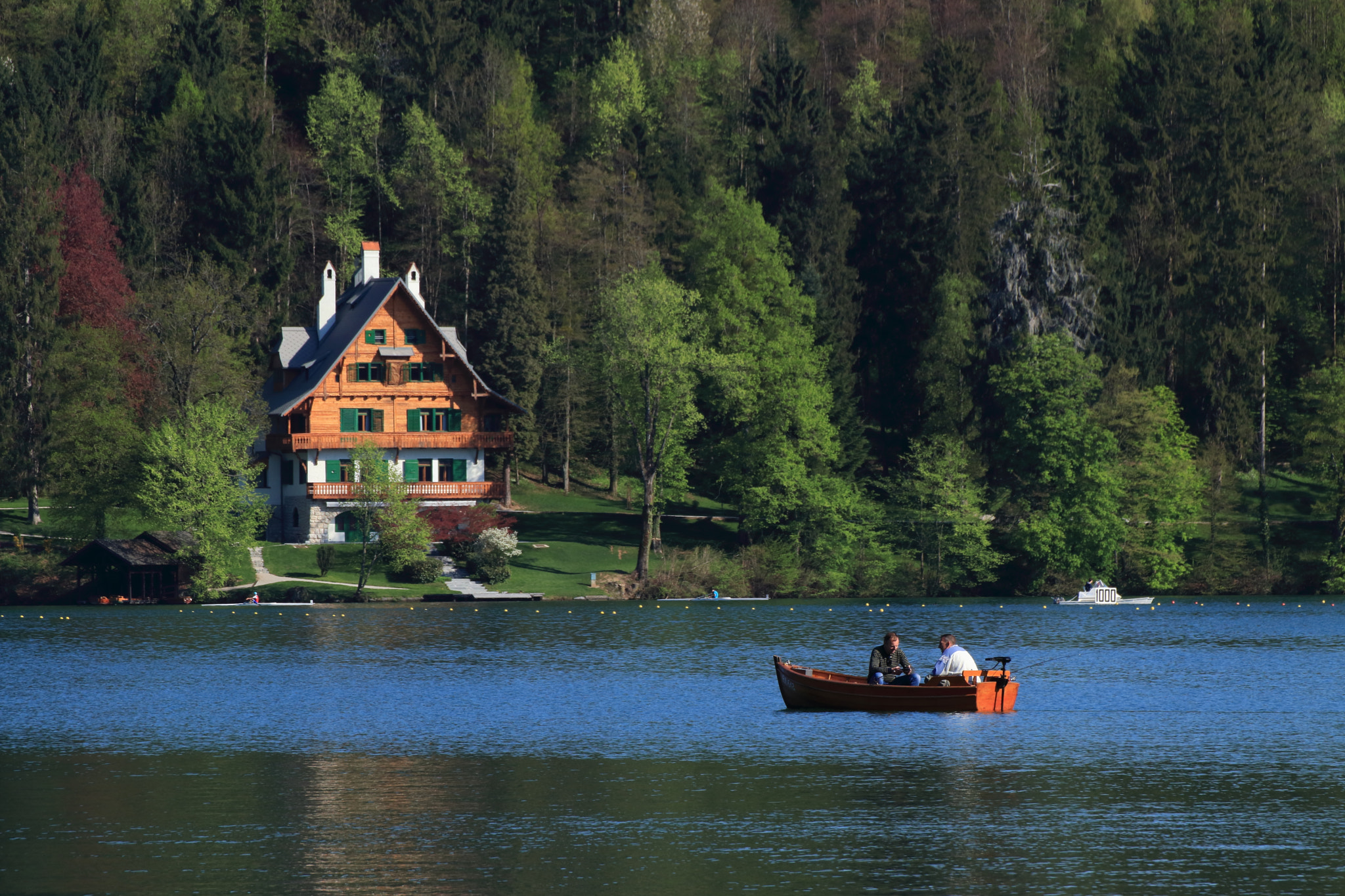 Tamron SP 70-300mm F4-5.6 Di VC USD sample photo. Boat on lake bled photography