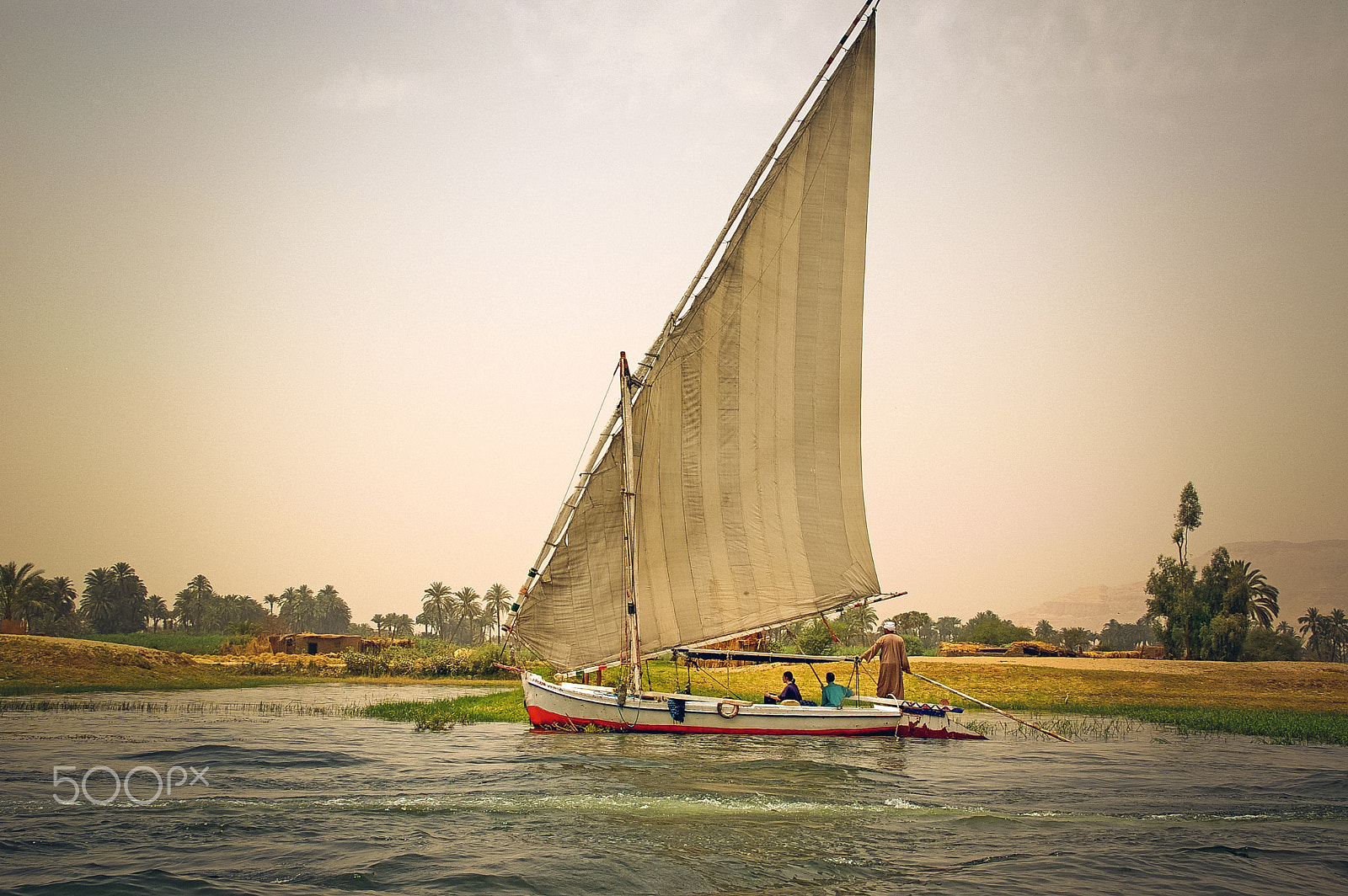 Pentax K100D sample photo. Boat on the river nile photography