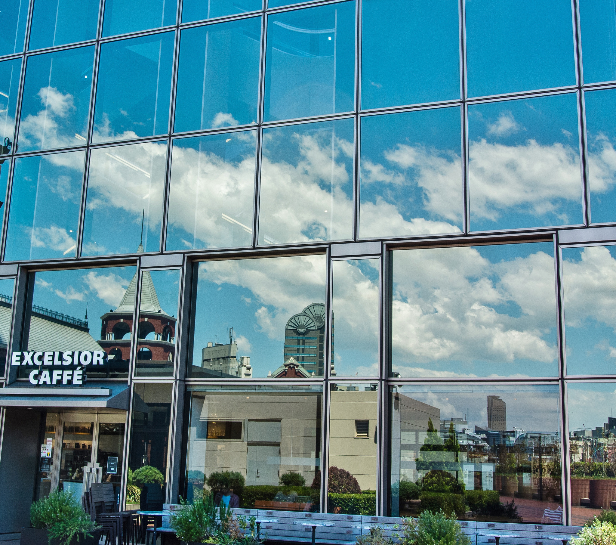 Nikon 1 V1 sample photo. The blue sky reflected in the glass window photography