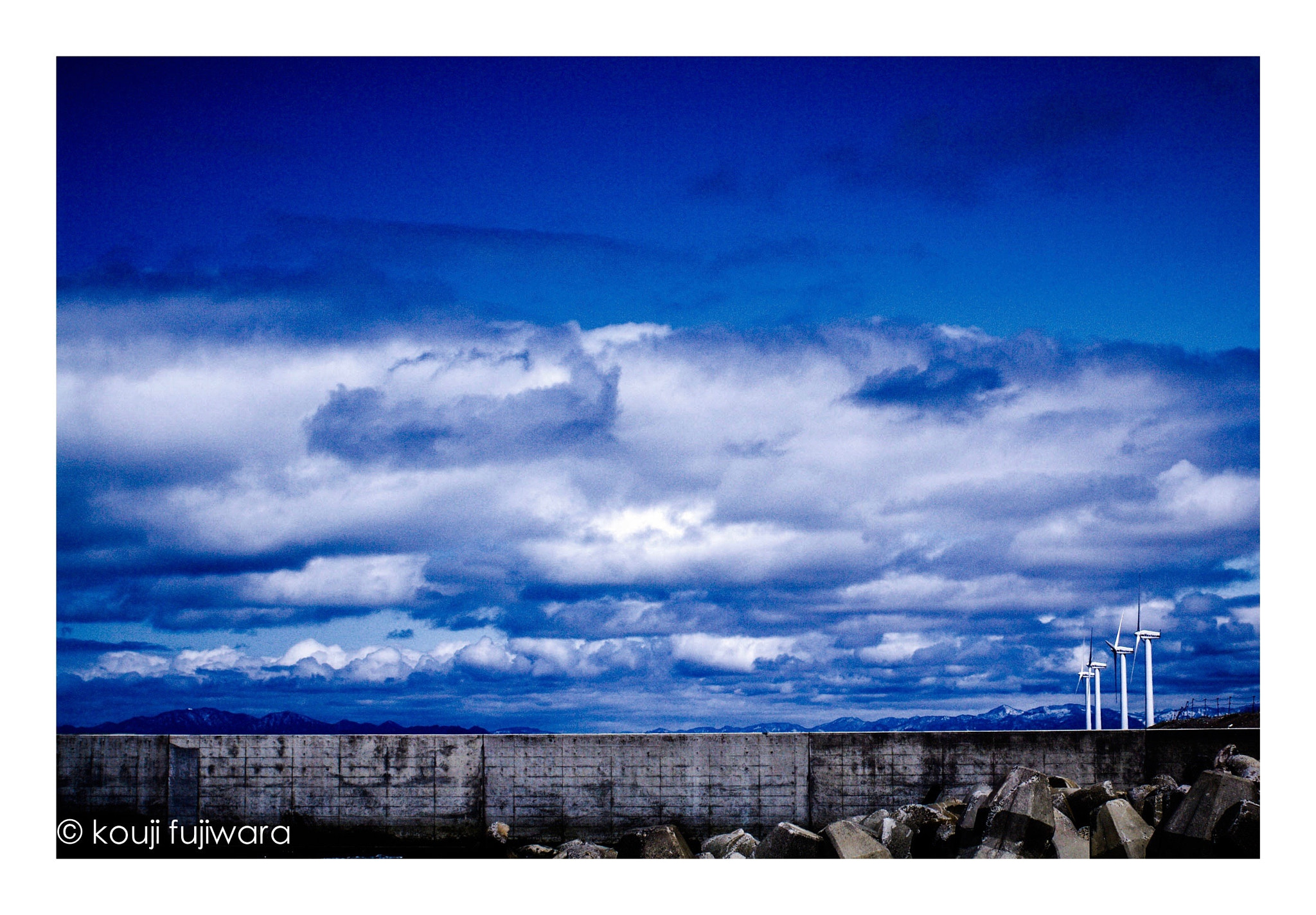 Pentax K-7 sample photo. Wind power windmill...under the white cloud photography