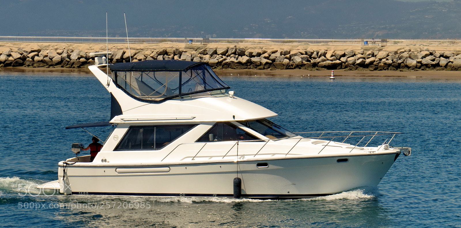 Canon PowerShot SX50 HS sample photo. Powerboat cruising marina channels photography