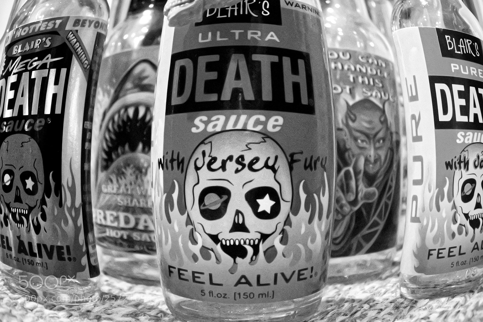 Nikon 1 J5 sample photo. Hot sauce bottles photography