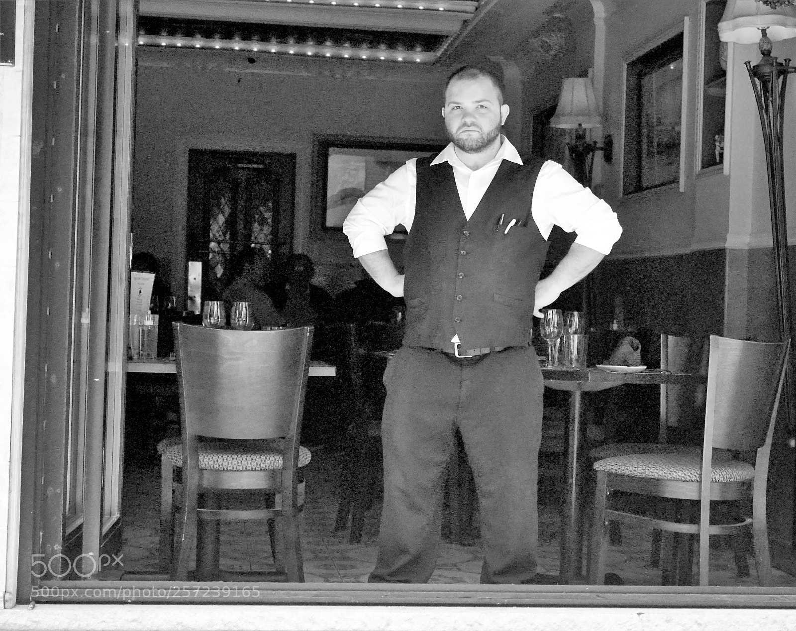 Sony a6500 sample photo. A waiter stands at photography