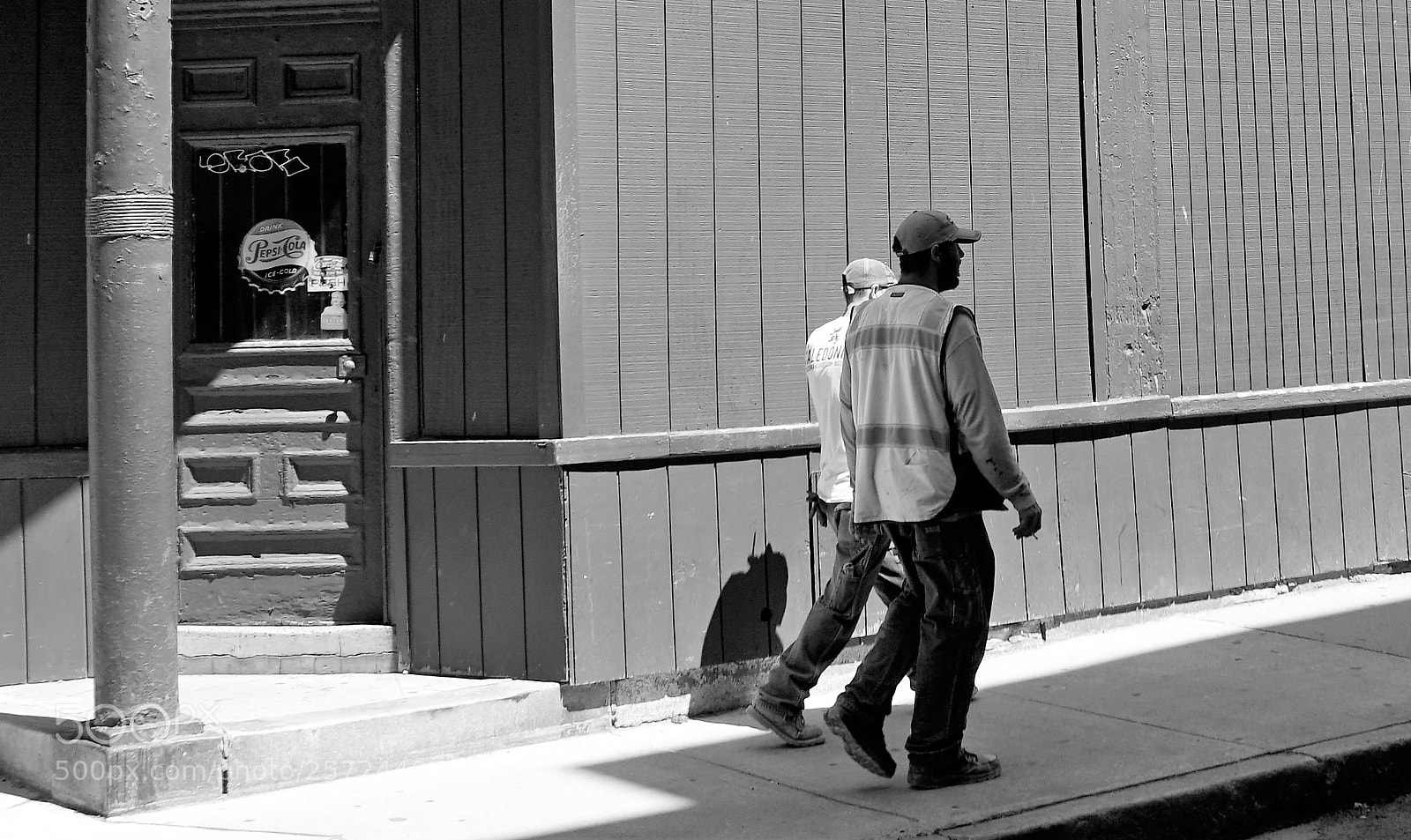 Sony a6500 sample photo. Walking past an old photography