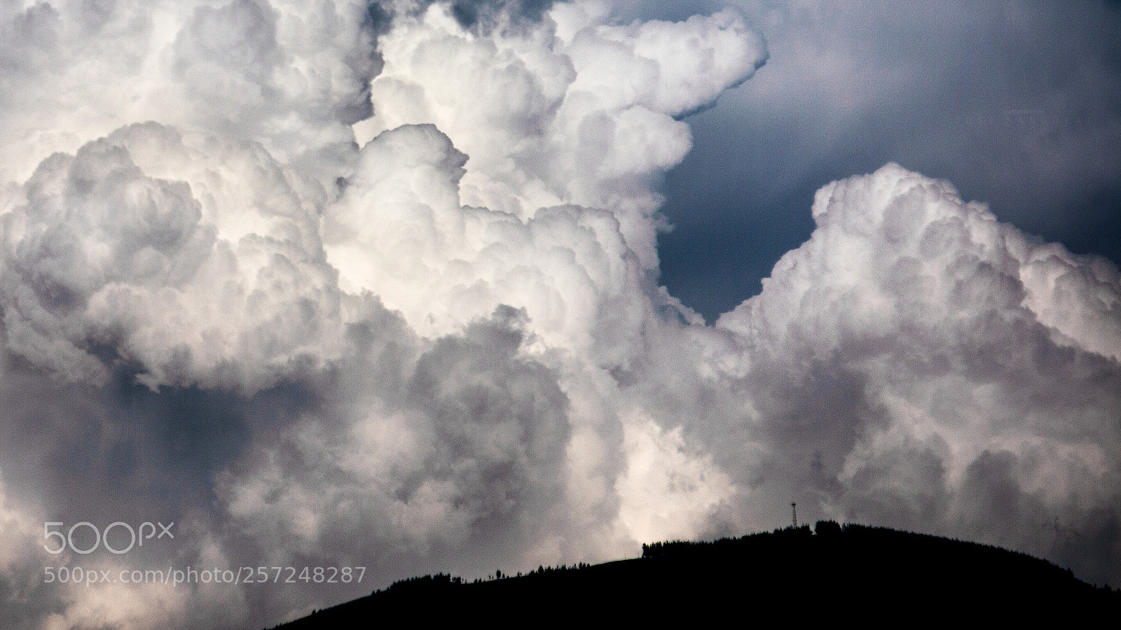 Canon EOS 70D sample photo. Cumulonimbus growing behind it photography