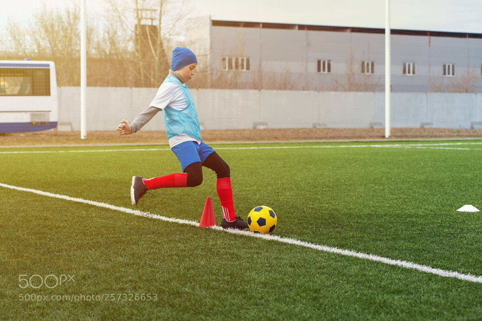 Nikon D700 sample photo. Boy kicking soccer ball photography