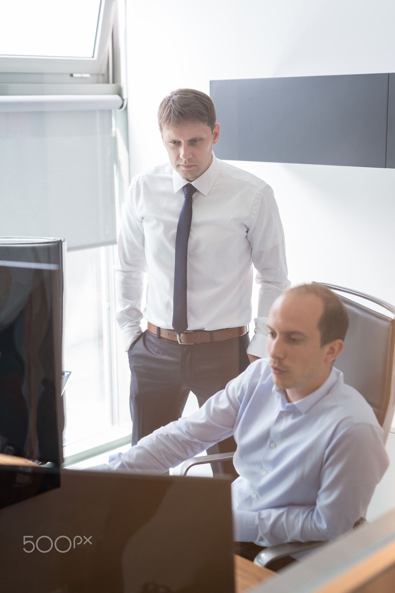 Business team analyzing data at business meeting.