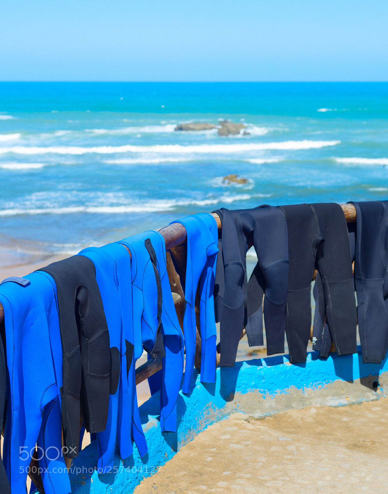 Nikon Df sample photo. Surfing wetsuits drying on photography