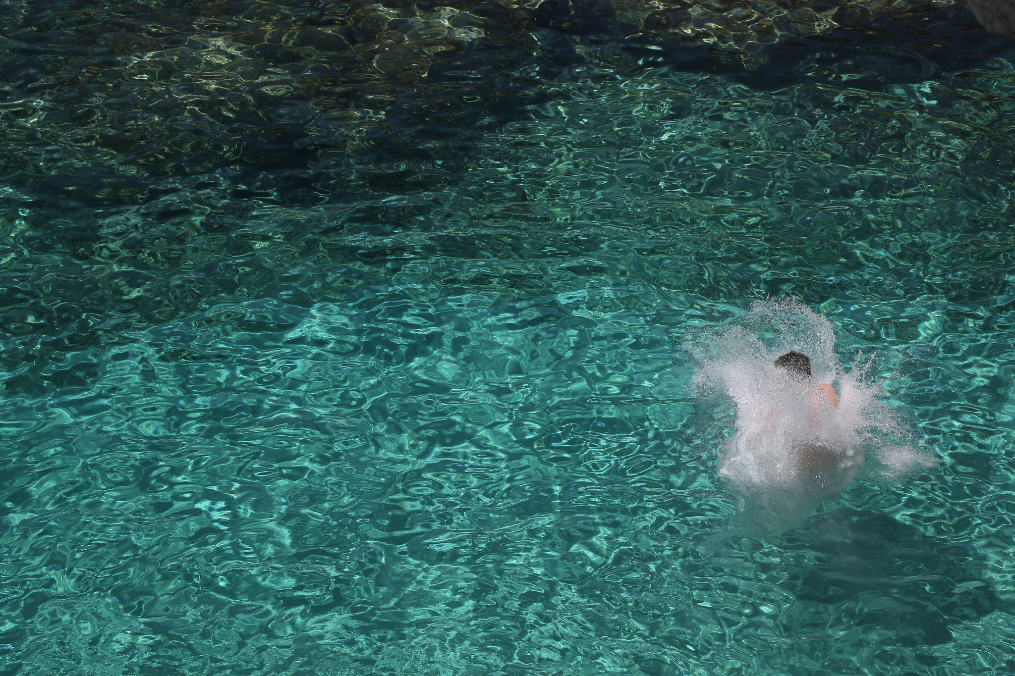 Canon EOS 7D Mark II sample photo. Jumping into the water photography