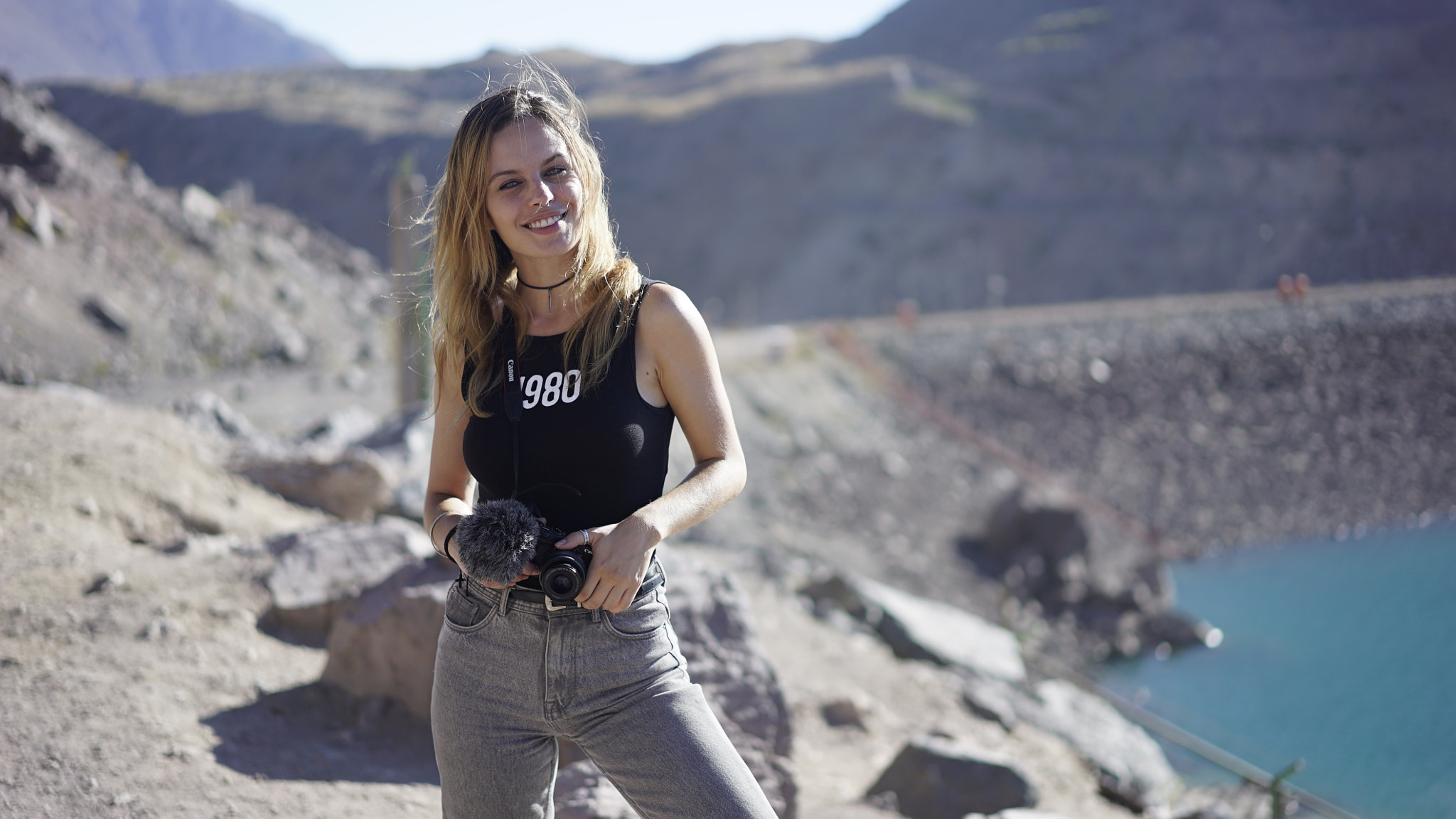 Sony Sonnar T* FE 55mm F1.8 ZA sample photo. Brazilian model with camera posing in nature park photography