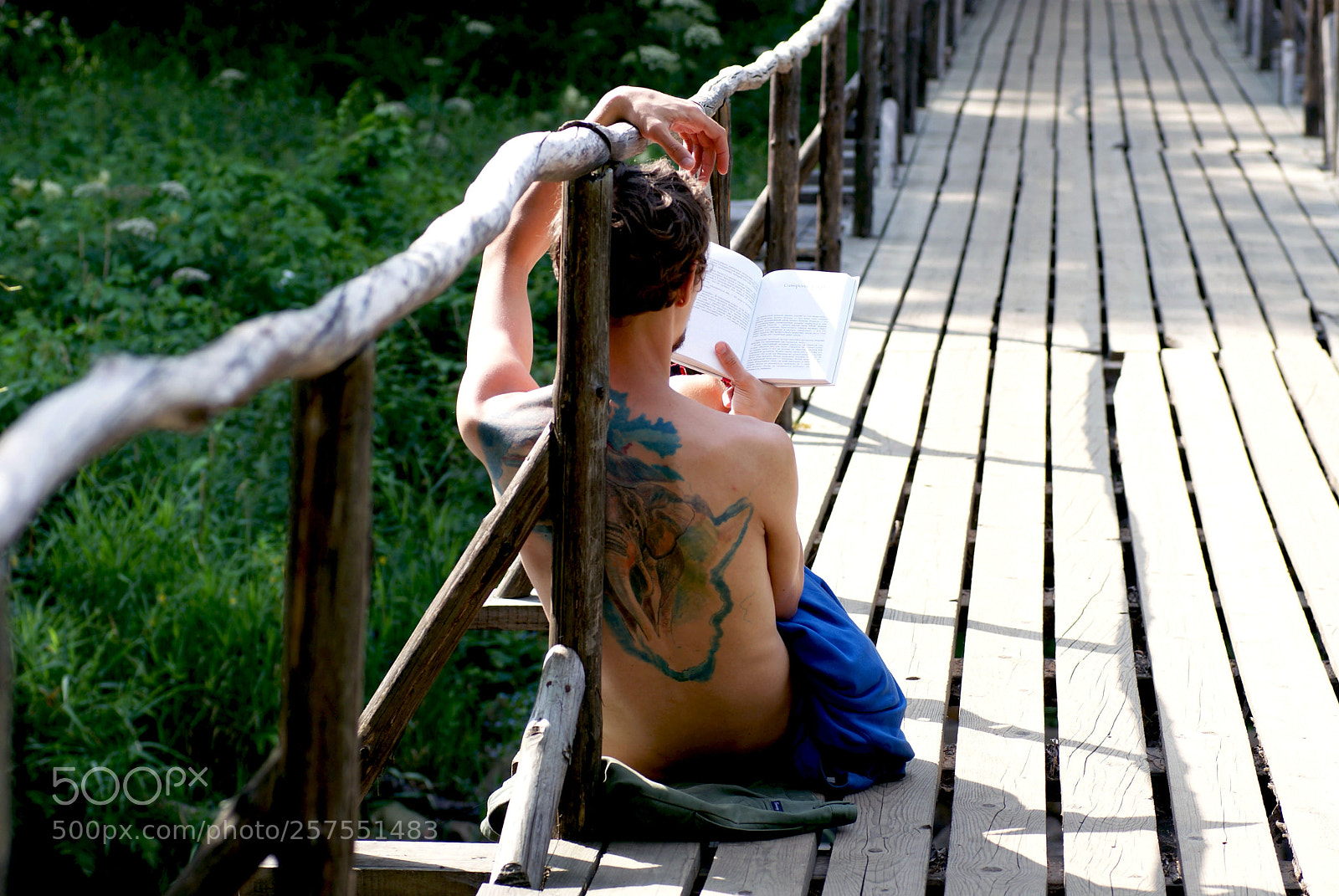 Sony Alpha DSLR-A230 sample photo. Man reading a book photography