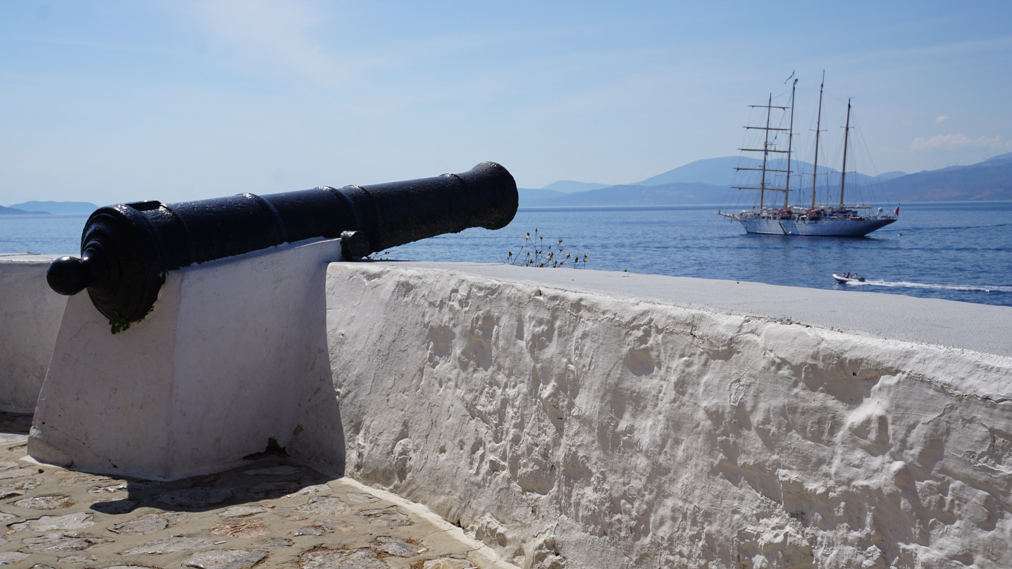Sony a6000 + Sony E 18-50mm F4-5.6 sample photo. Cannon pointed at boat photography