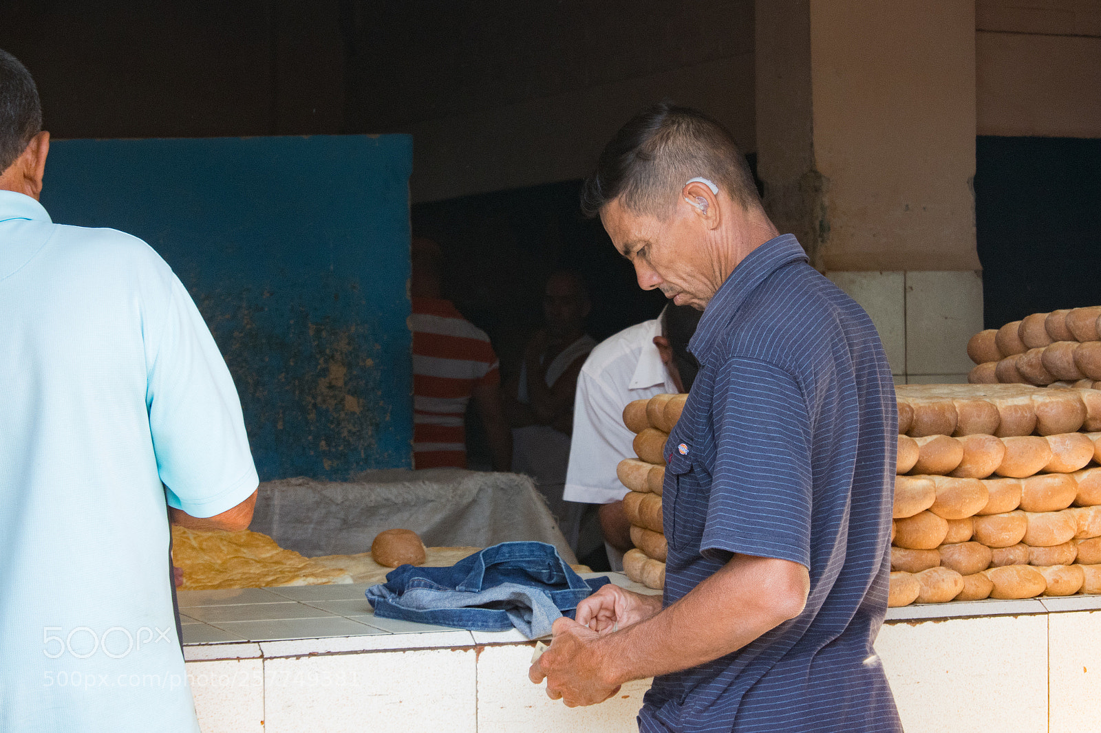 Nikon 1 J5 sample photo. Man buying bread in photography
