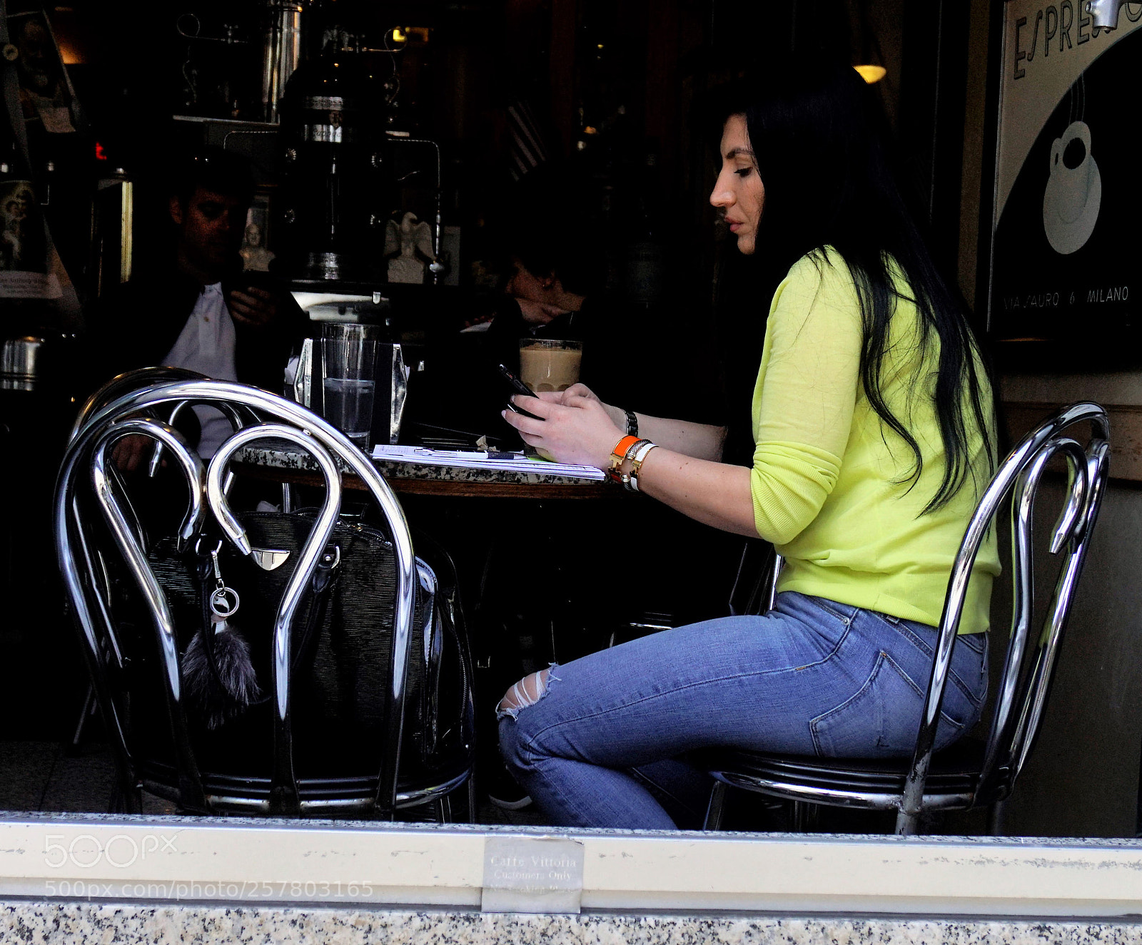 Sony a6500 sample photo. A woman sits at photography