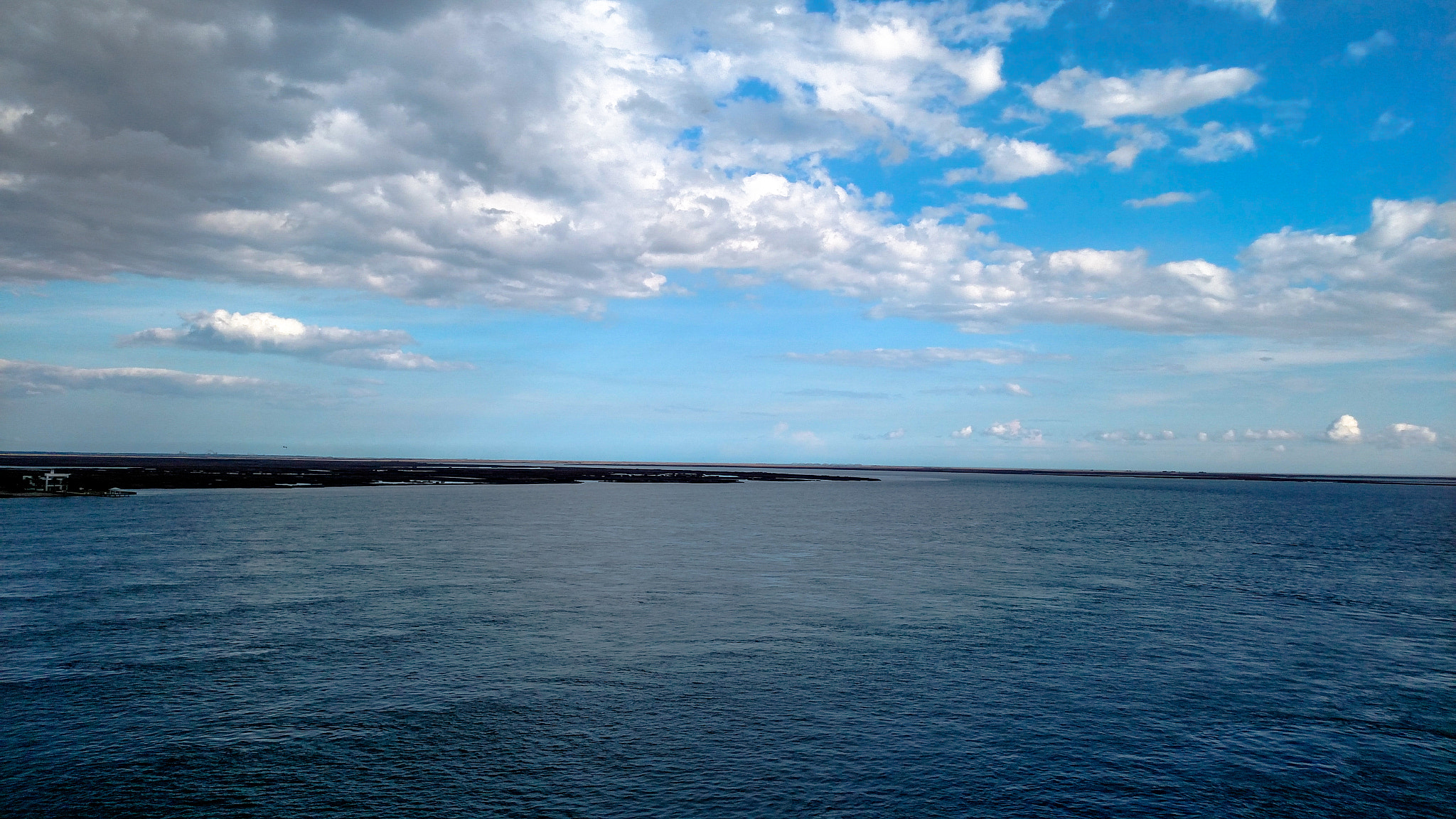 Motorola Droid Turbo sample photo. Distant water skyline photography