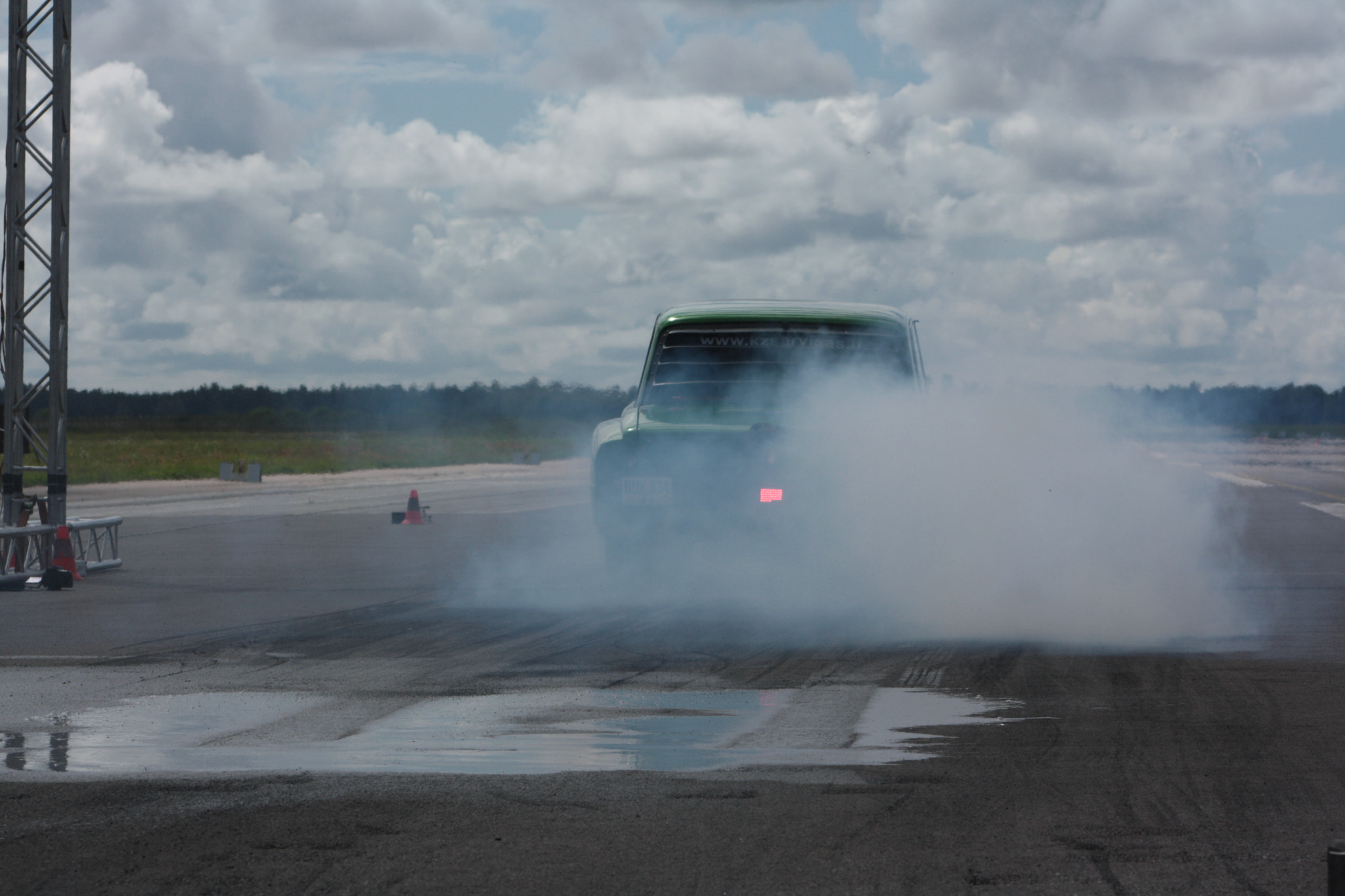 Canon EF 75-300mm f/4-5.6 sample photo. Car in smoke photography