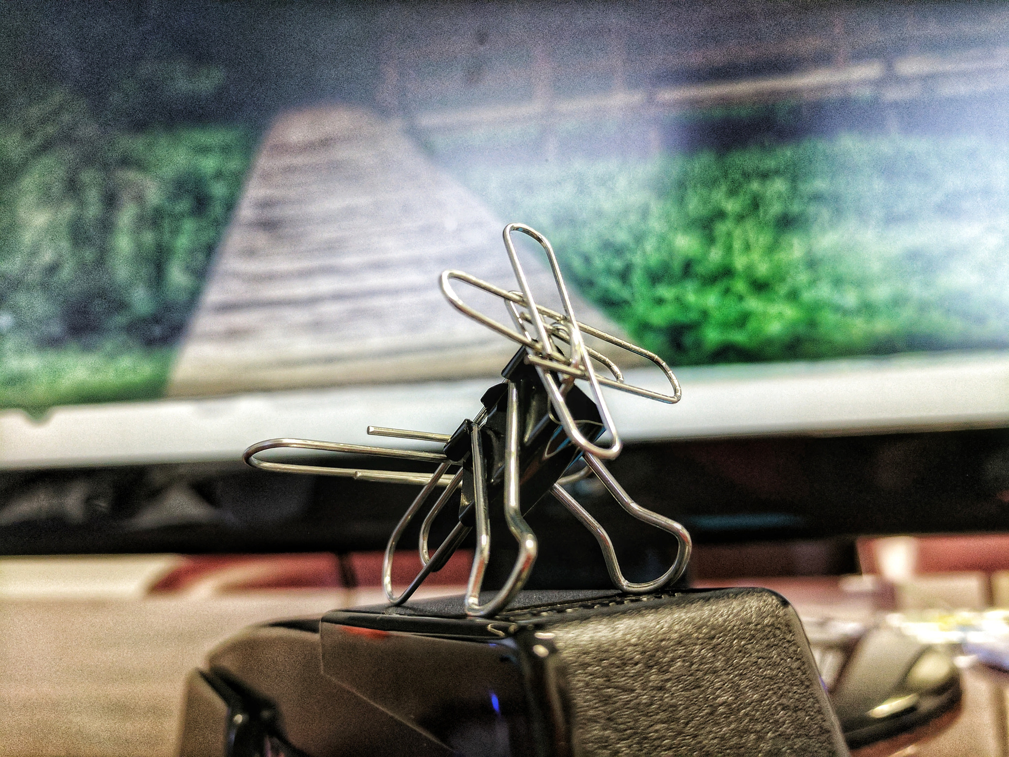 Google Pixel XL sample photo. Binder clip and paper pin aircraft photography