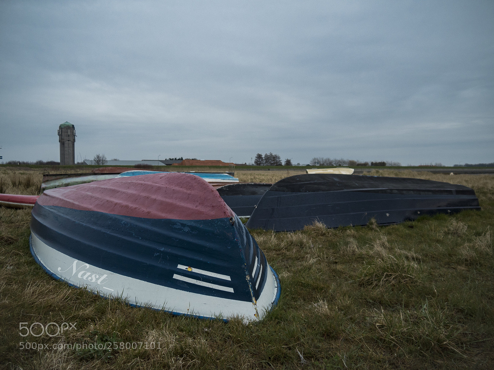 Olympus OM-D E-M5 II sample photo. Boats in a field photography