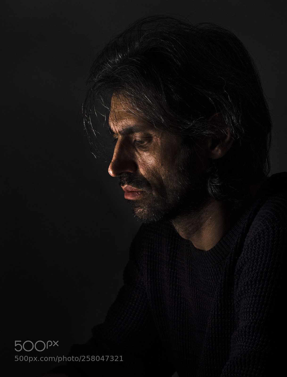 Olympus OM-D E-M10 II sample photo. Man's portrait. low key photography