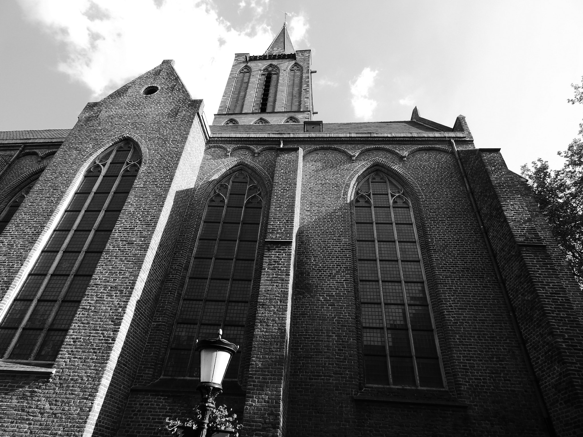 Panasonic DC-FZ83 sample photo. In the shadow of the church photography