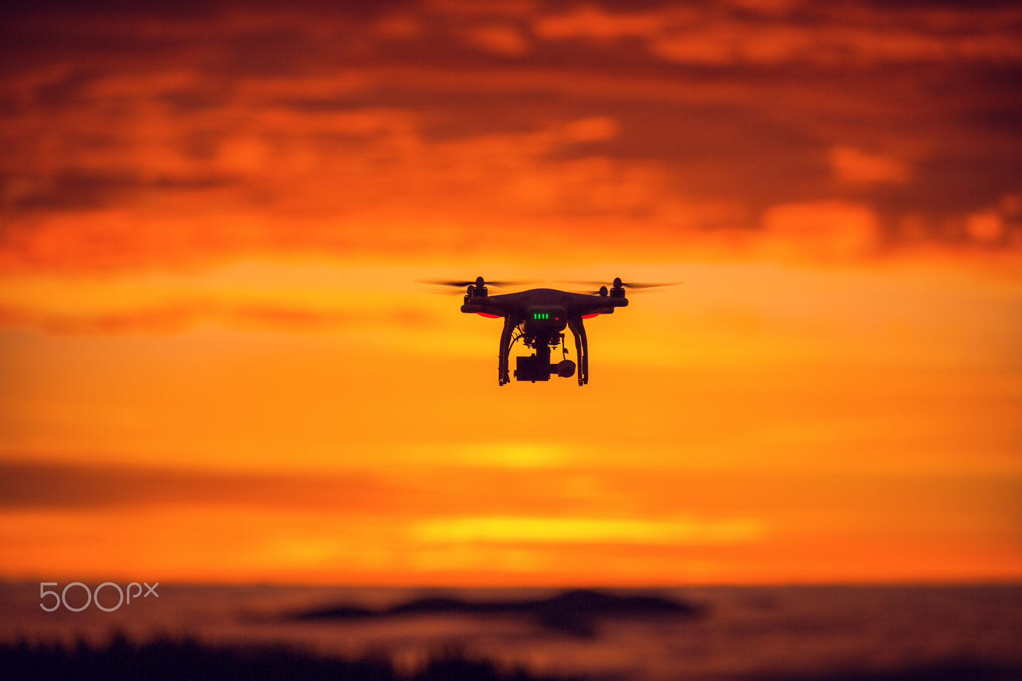 Flying drone above the clouds