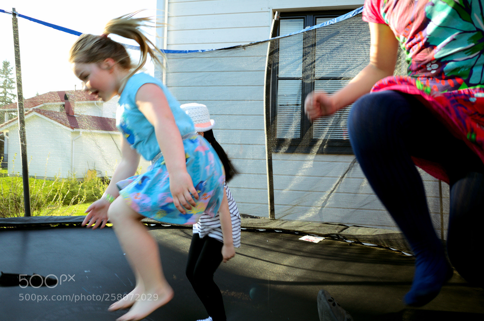 Ricoh GR II sample photo. Kids on trampoline photography