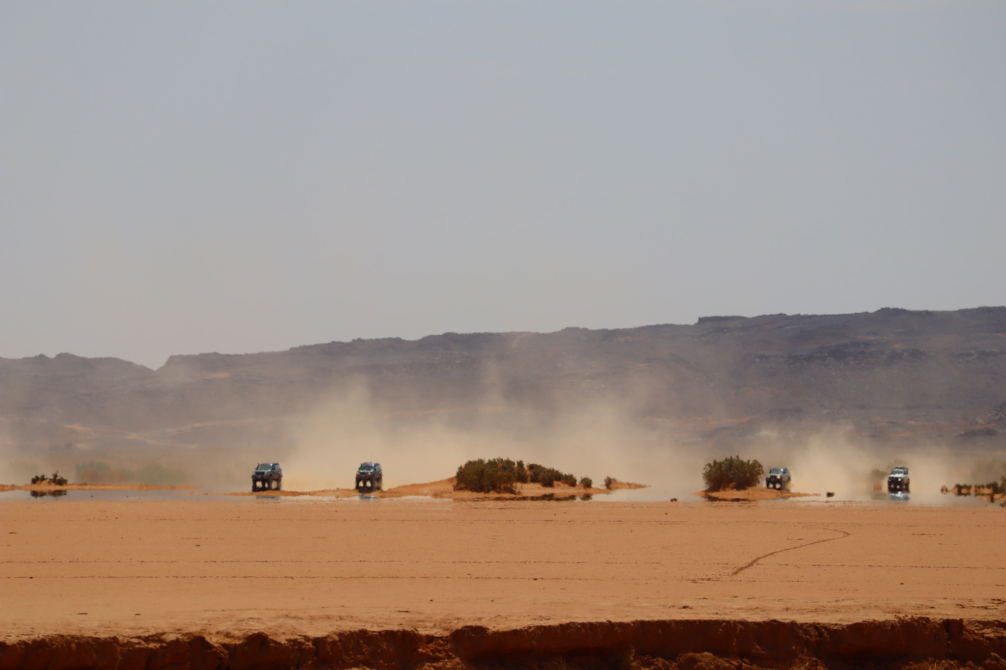Canon EOS M50 (EOS Kiss M) sample photo. Cars driving through a mirage photography