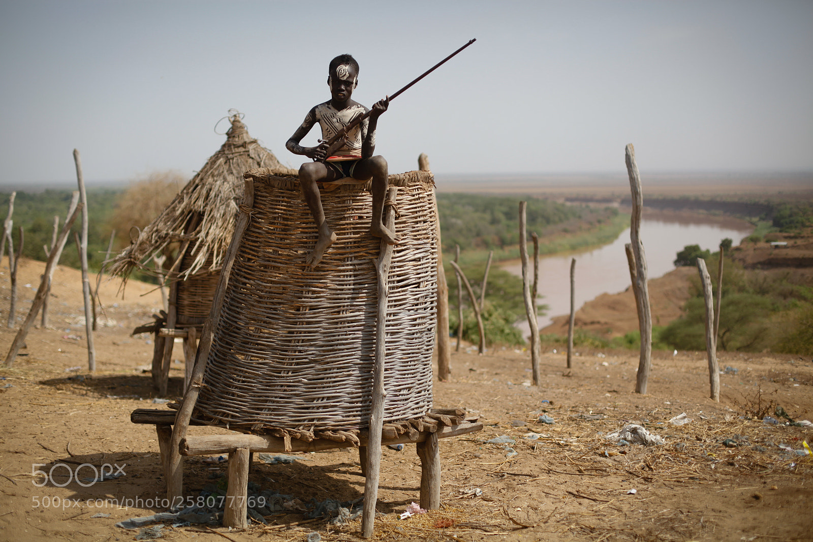 Canon EOS 5D Mark II sample photo. Karo boy with gun photography