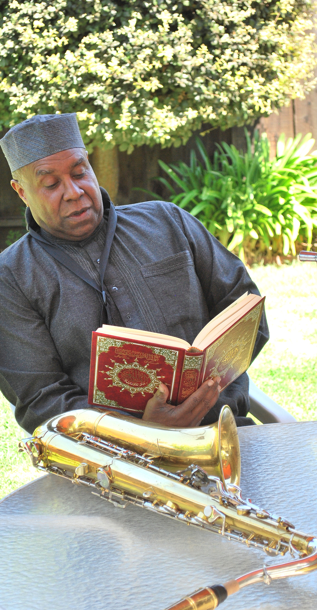 Nikon D60 sample photo. Muslim musician reading. photography