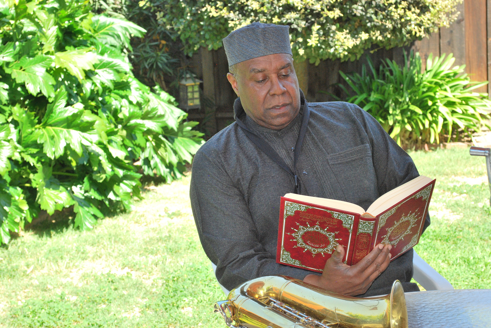 Nikon D60 sample photo. Muslim musician reading. photography