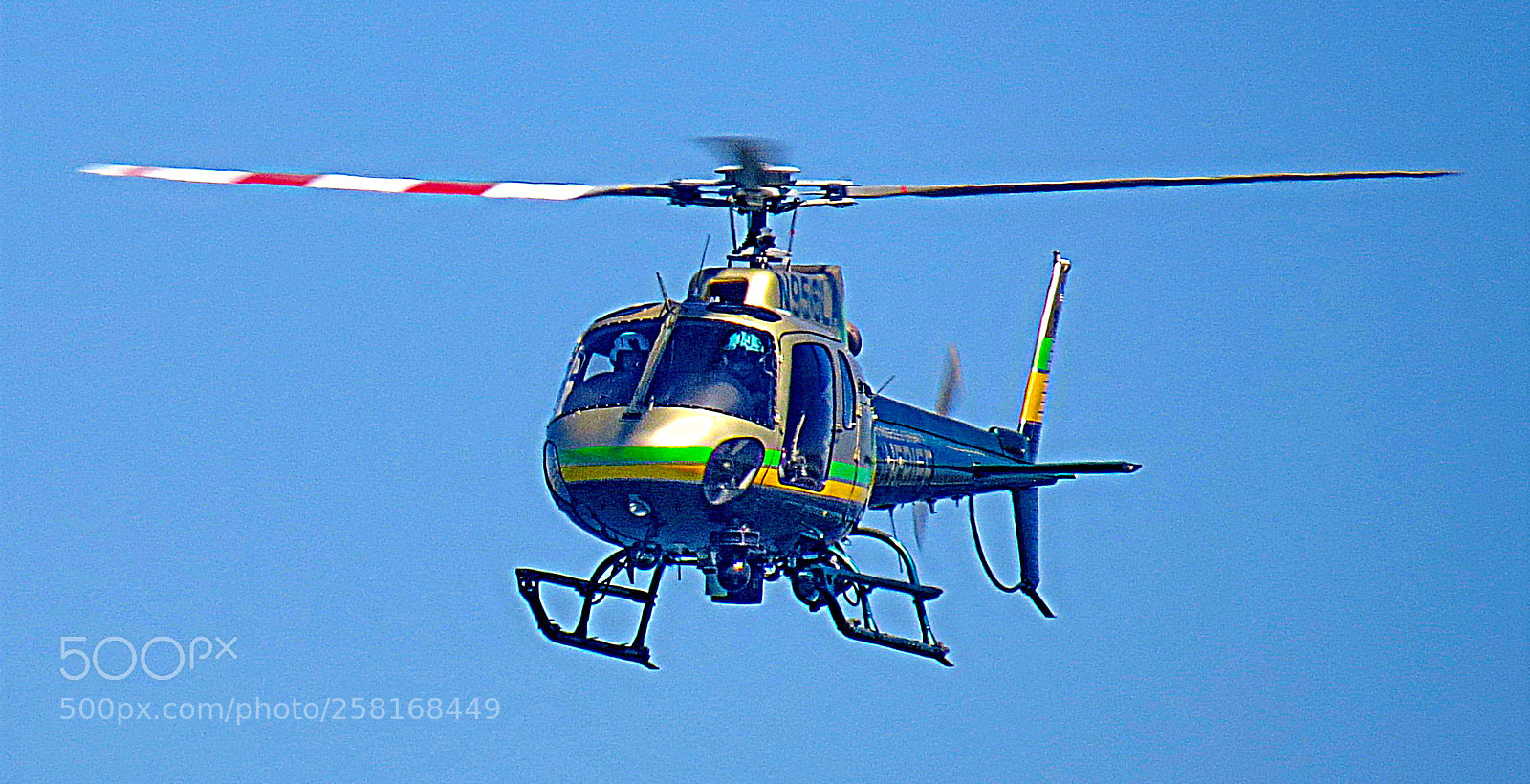 Canon PowerShot SX50 HS sample photo. Helicopter flying over the photography