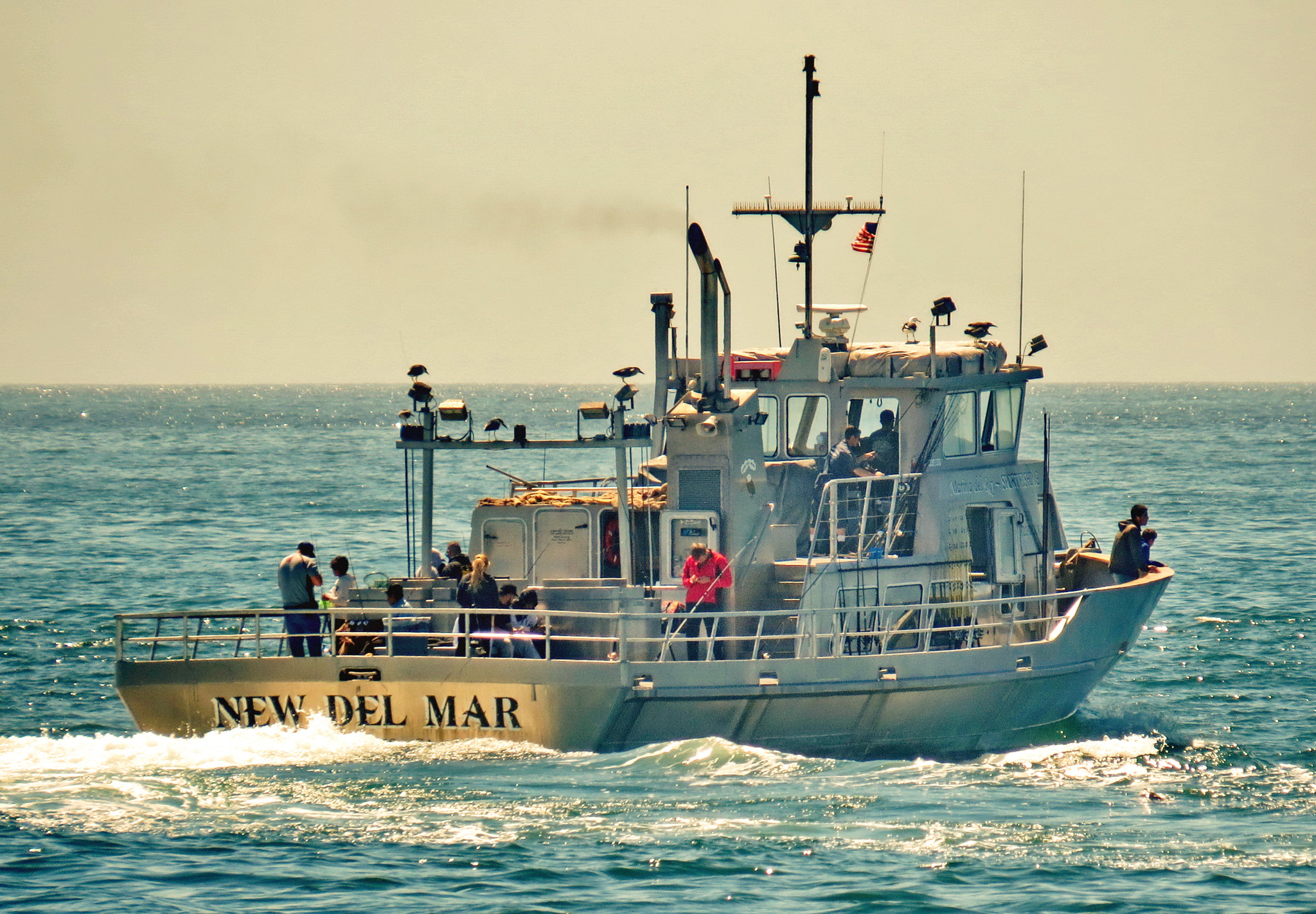 Canon PowerShot SX50 HS + 4.3 - 215.0 mm sample photo. Fishing boat heading out to the ocean photography