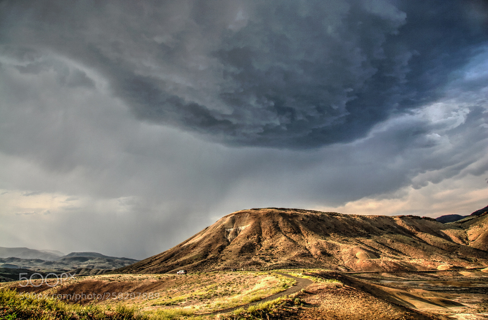 Canon EOS 20D sample photo. Thunderhead looms above the photography