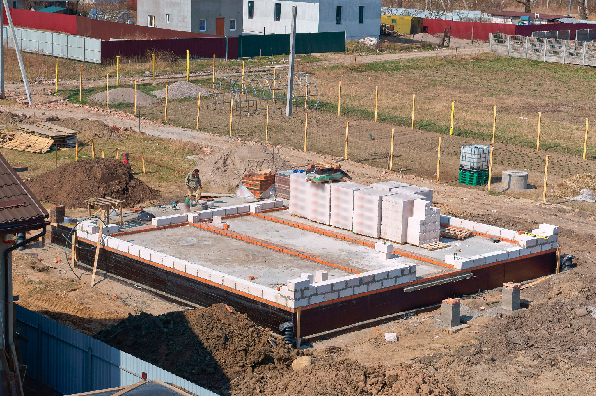 Sony Alpha NEX-3N sample photo. The foundation of the house under construction, fresh concrete foundation, cement-filled... photography