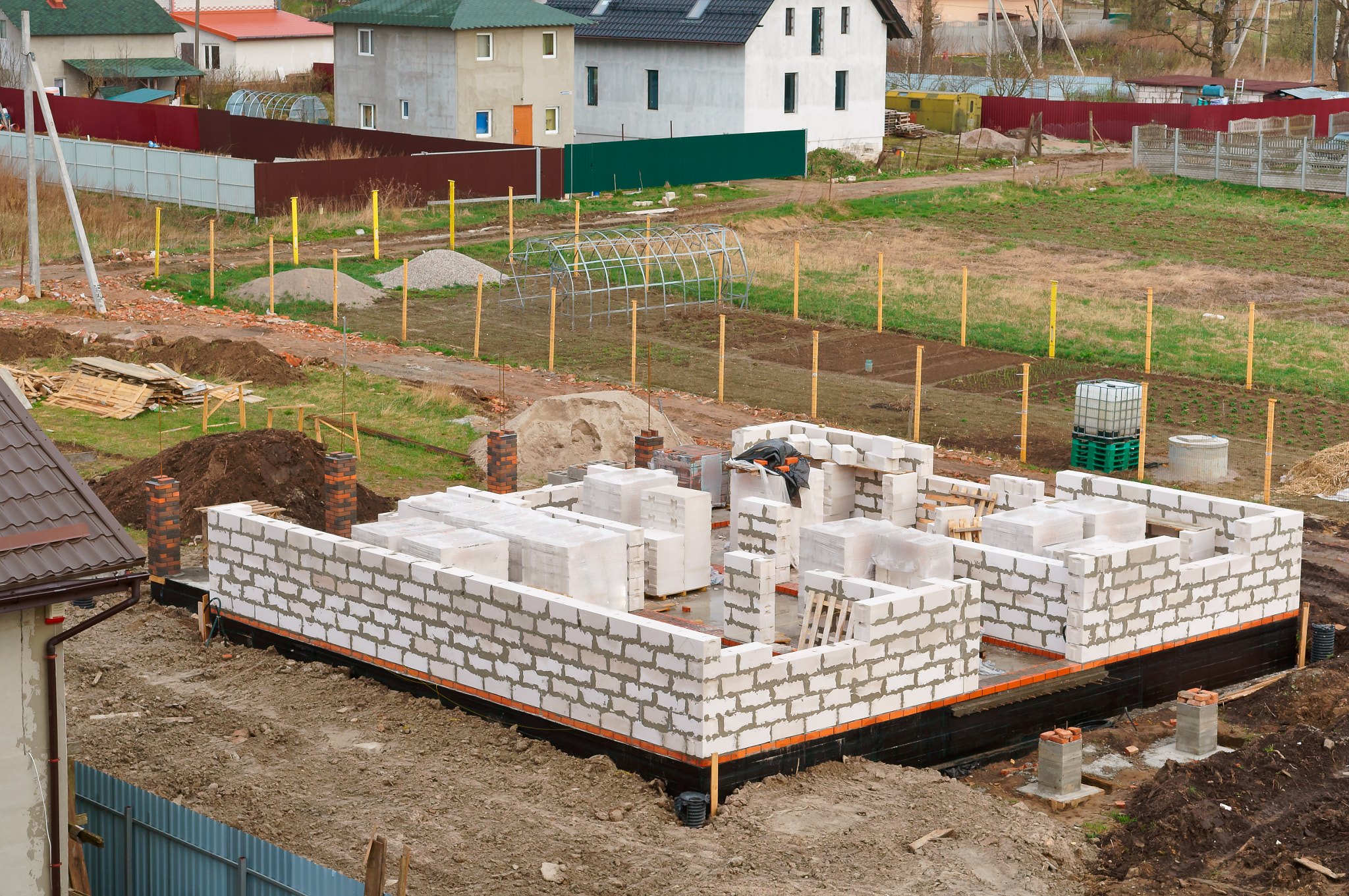 the Foundation of the house under construction, fresh concrete Foundation, cement-filled...