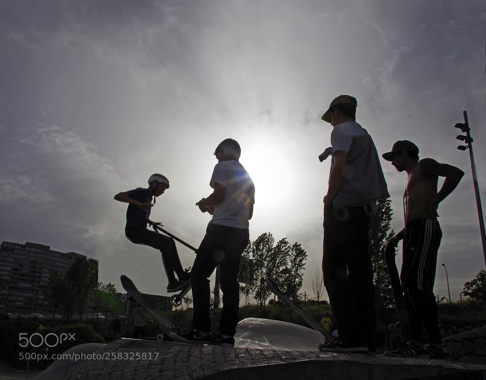 Pentax K-50 sample photo. Backlit skaters photography