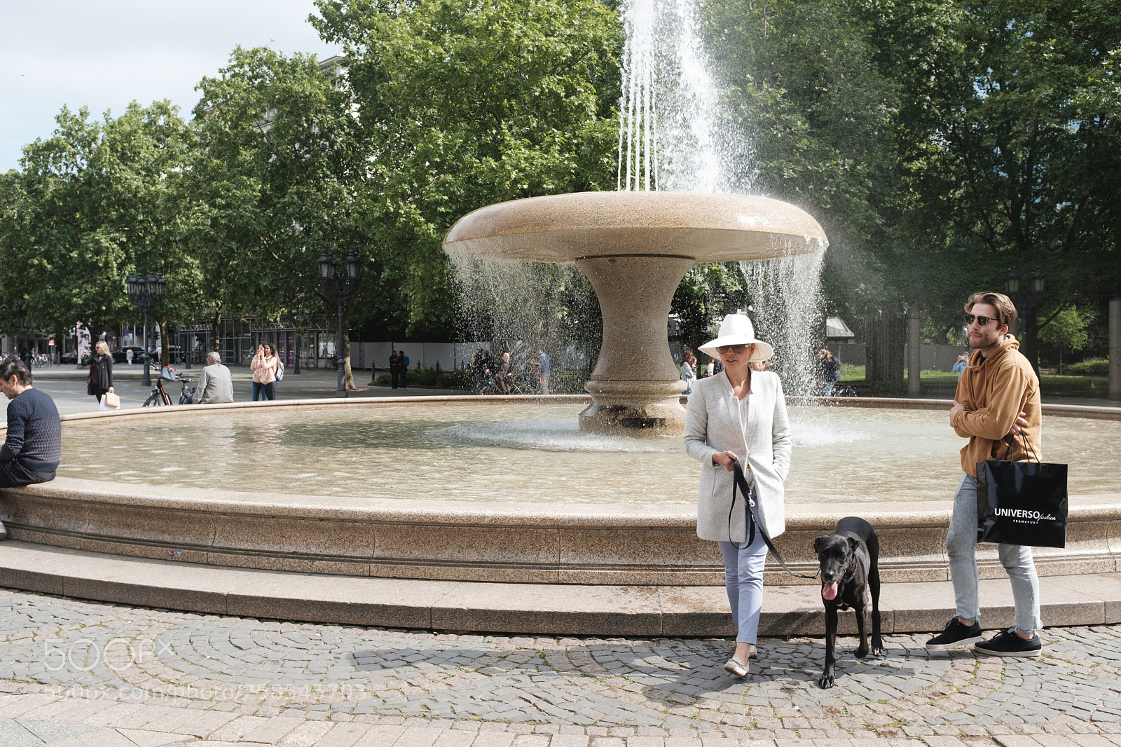 Fujifilm X100F sample photo. Rich woman strolling with photography