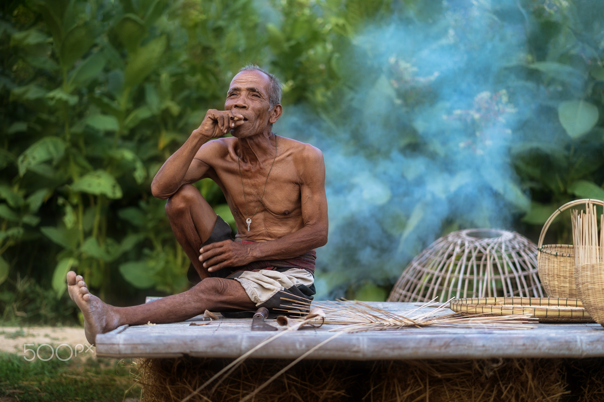 Elderly man lifestyle of the locals with craft bamboo