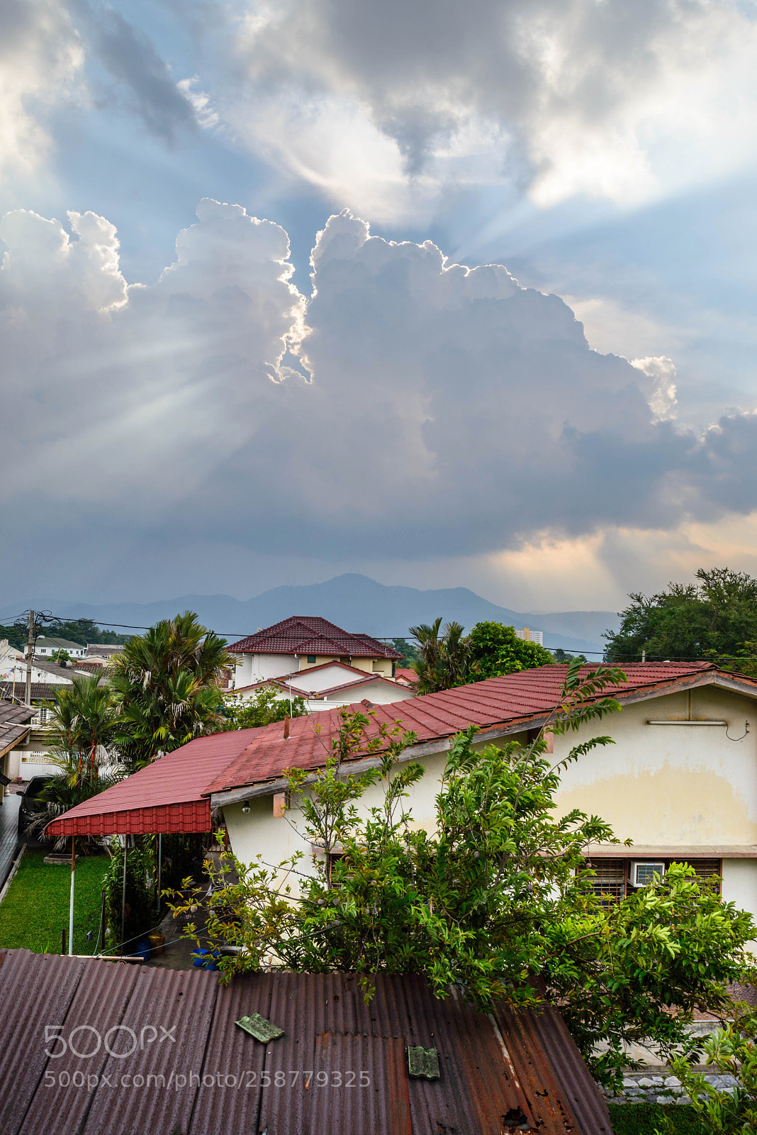 Nikon D610 sample photo. Cloudy with ray at photography