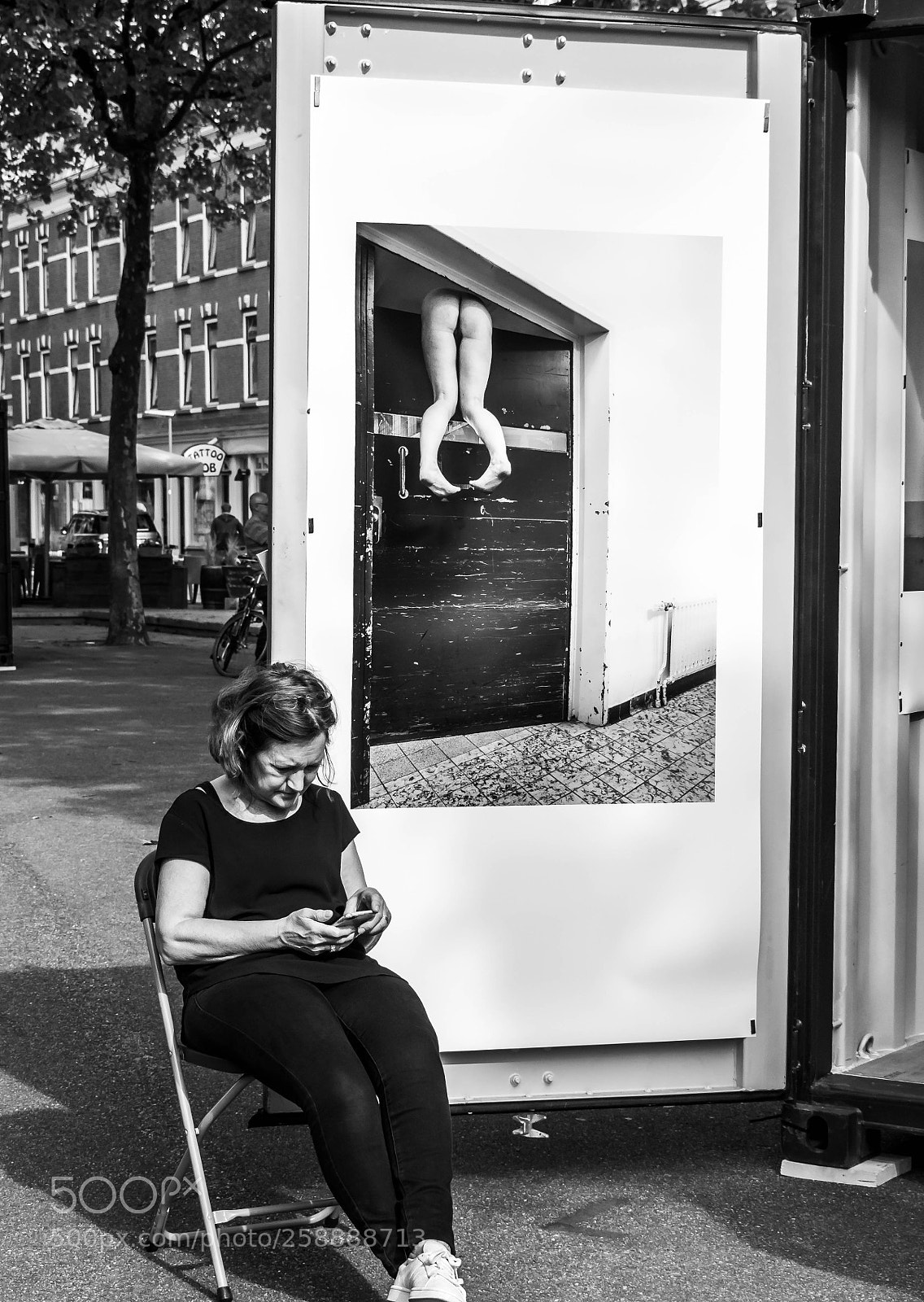 Olympus OM-D E-M10 II sample photo. Checking her phone photography