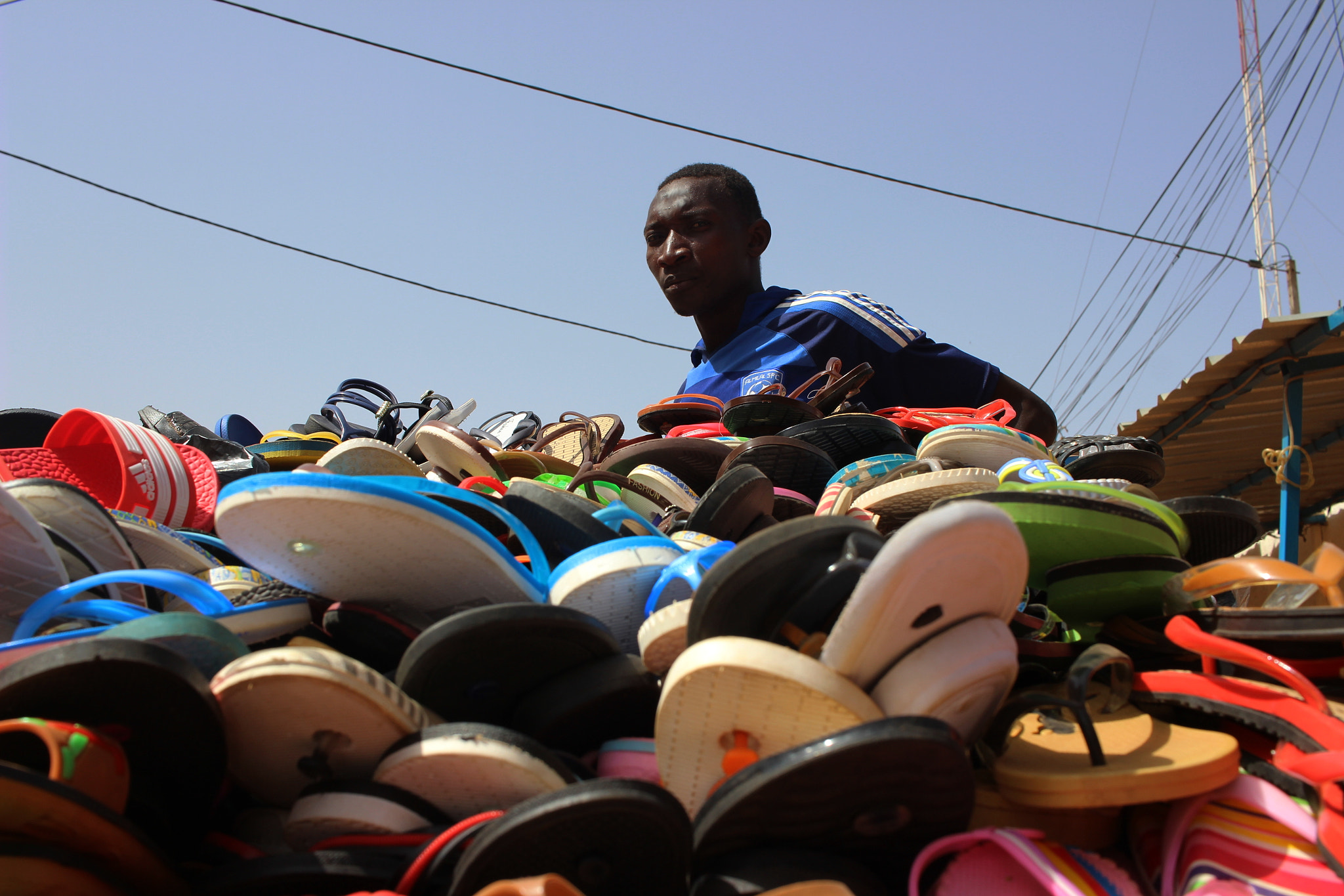 Canon EF-S 24mm F2.8 STM sample photo. Shoes seller photography