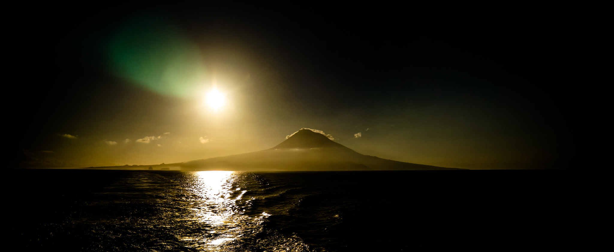 Samsung NX30 sample photo. Contre jour view to sunrise over pico volcano and island, azores, portugal photography