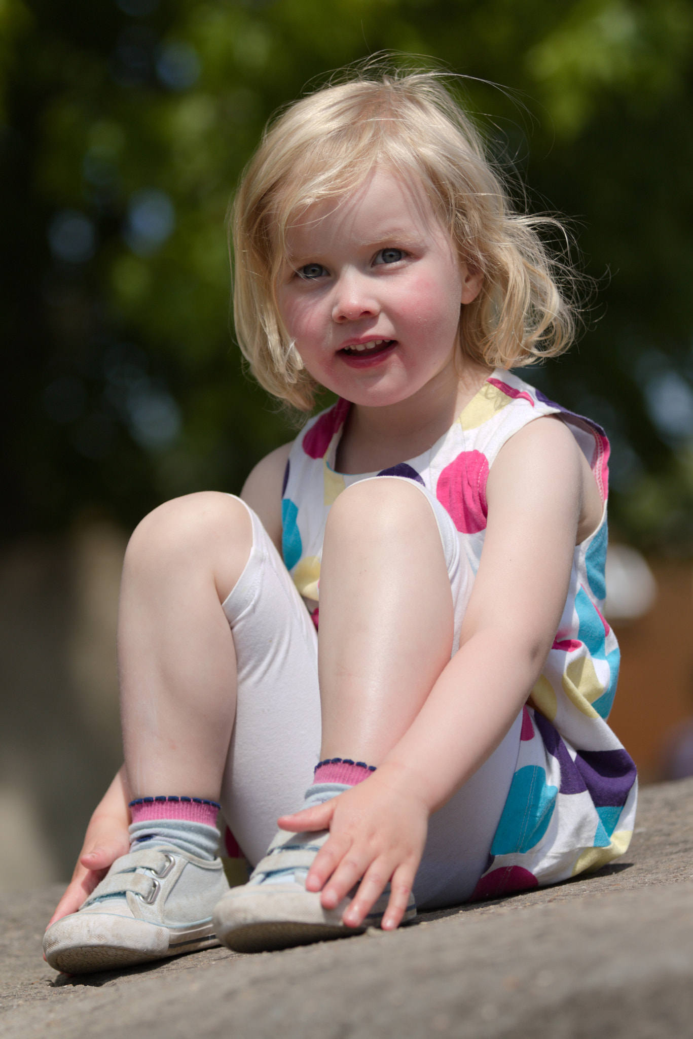 Canon EOS 7D Mark II sample photo. Young girl sitting on a  rock photography