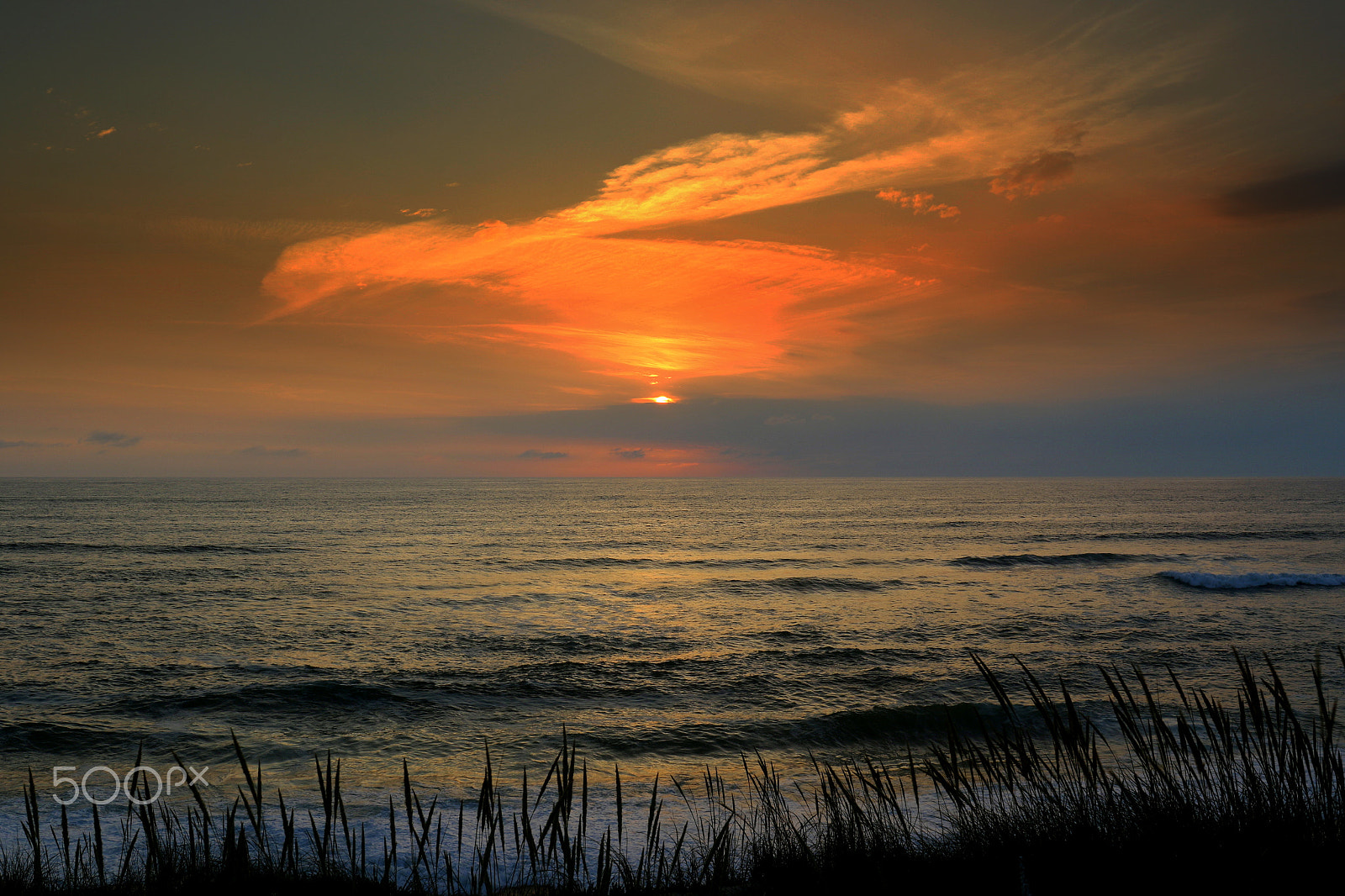 Canon EF 24-70mm F4L IS USM sample photo. Clouds by sunset photography