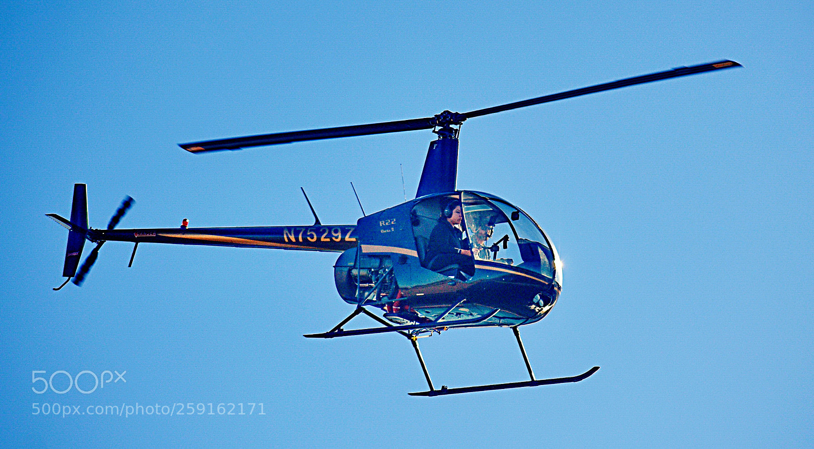 Nikon D7200 sample photo. Blue a helicopter flying photography