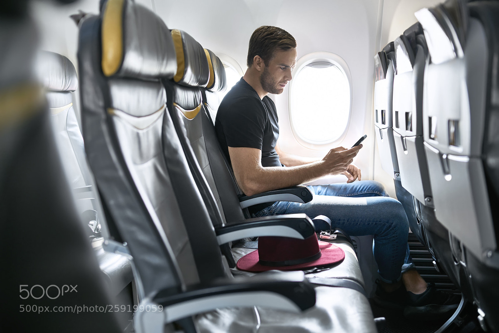 Sony a7R II sample photo. Handsome guy in airplane photography