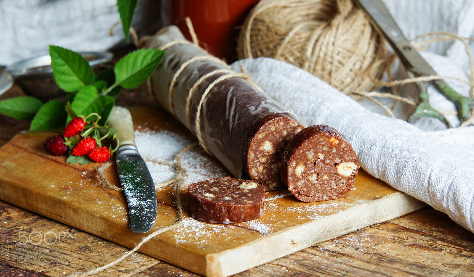 Sony Alpha NEX-5R sample photo. Chocolate salami with biscuits and hazelnuts photography